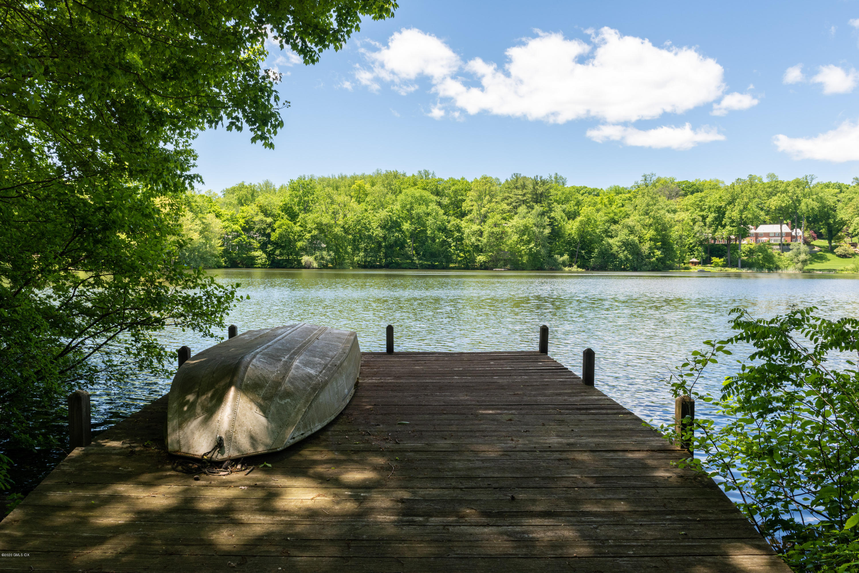 51-0 Burying Hill Road Greenwich, CT 06831 - Photo 1 of 47 a view of a lake with an outdoor space