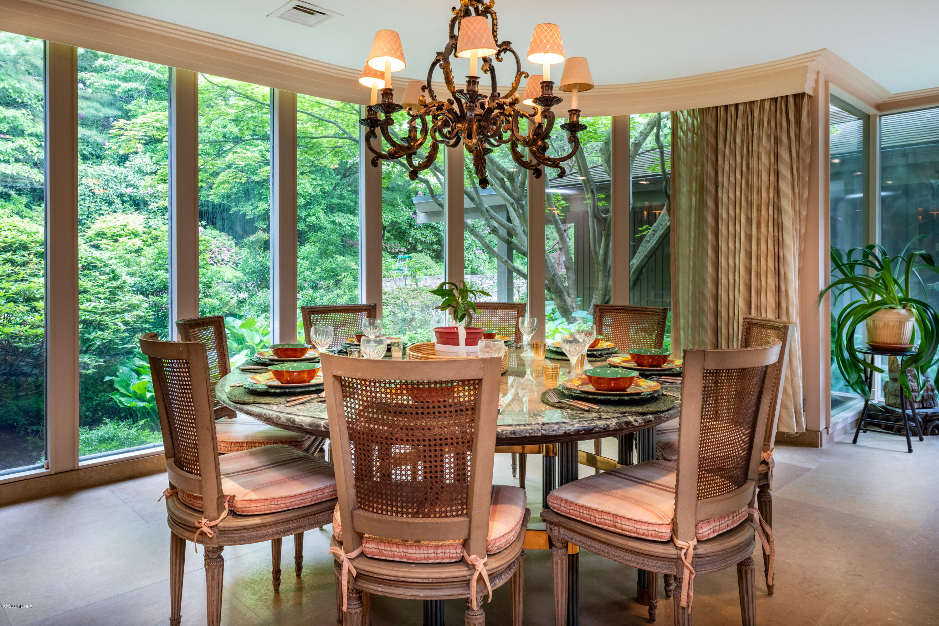 51-0 Burying Hill Road Greenwich, CT 06831 - Photo 14 of 47 a dining room with furniture and a floor to ceiling window