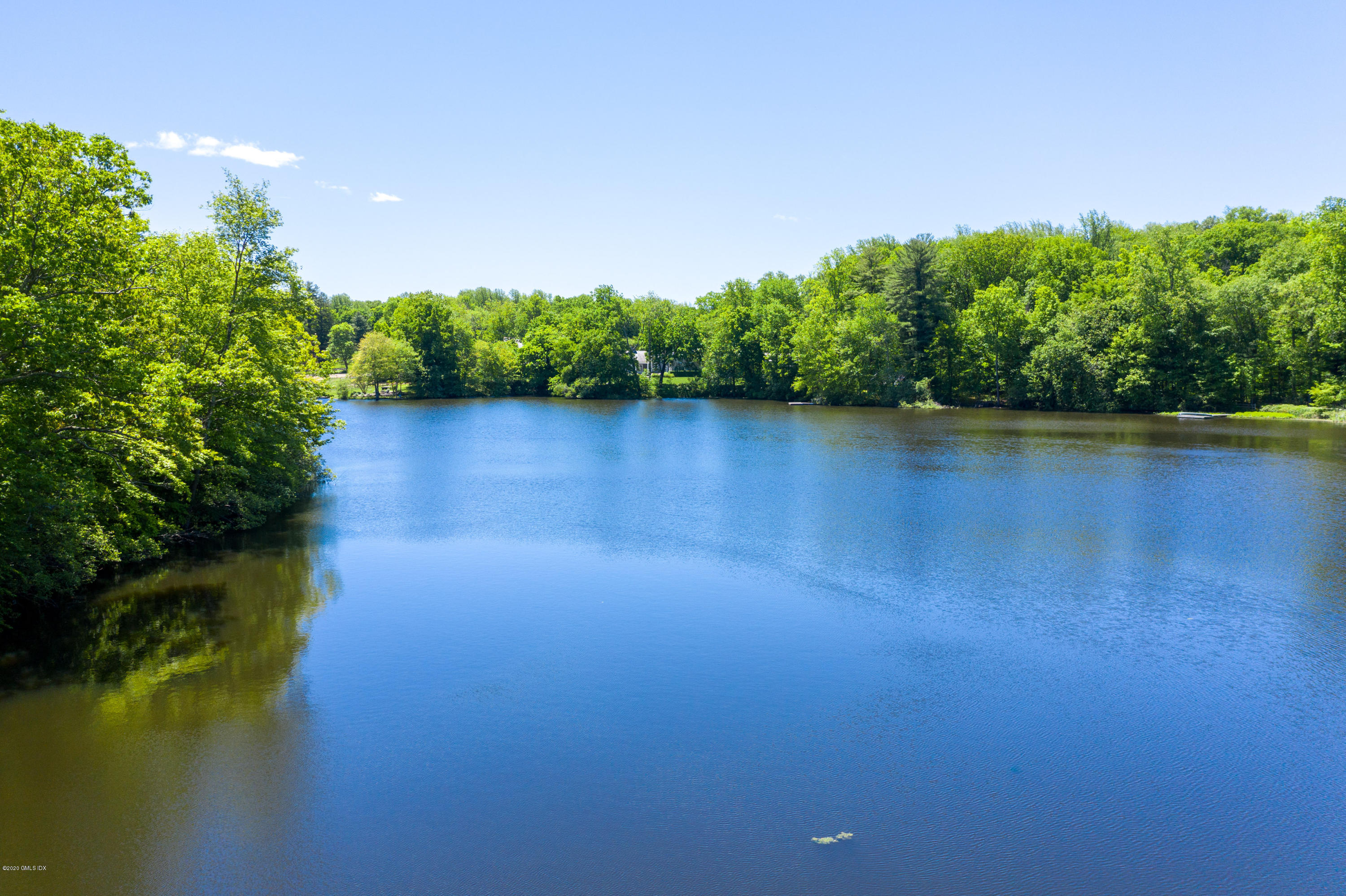 51-0 Burying Hill Road Greenwich, CT 06831 - Photo 2 of 47 a view of a lake with a outdoor space