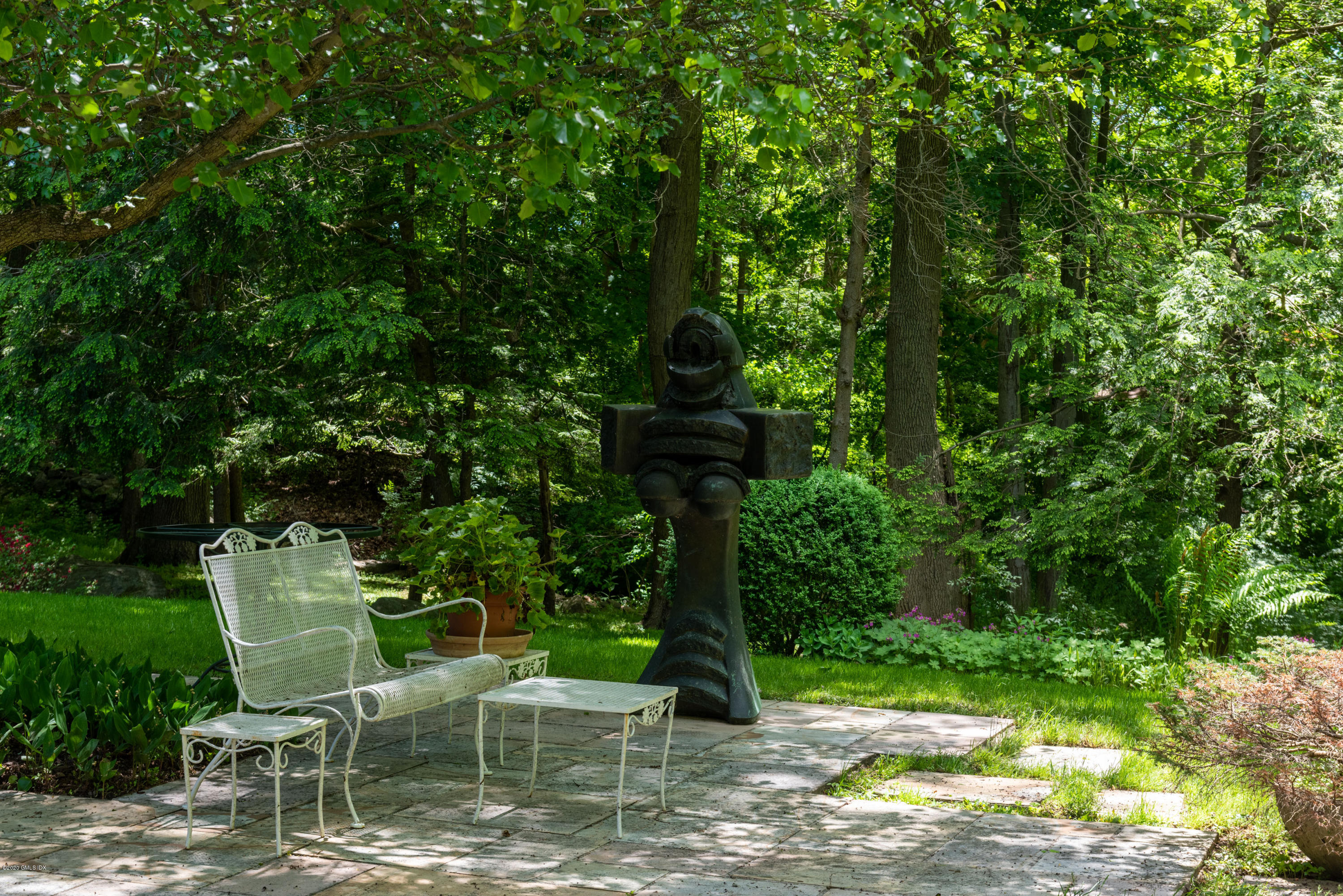 51-0 Burying Hill Road Greenwich, CT 06831 - Photo 28 of 47 a view of a chairs and tables in the backyard of a house