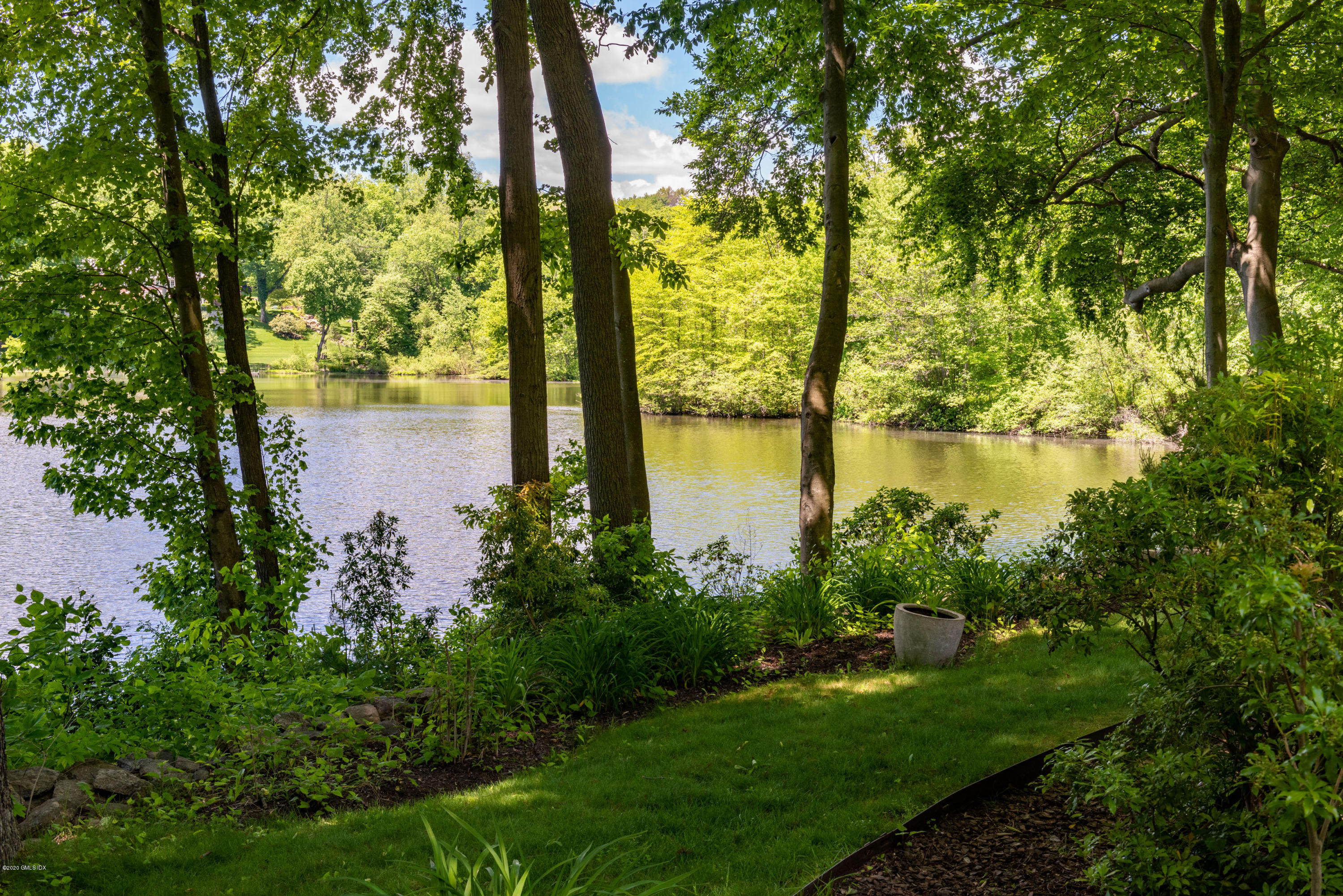 51-0 Burying Hill Road Greenwich, CT 06831 - Photo 36 of 47 a view of a lake from a yard