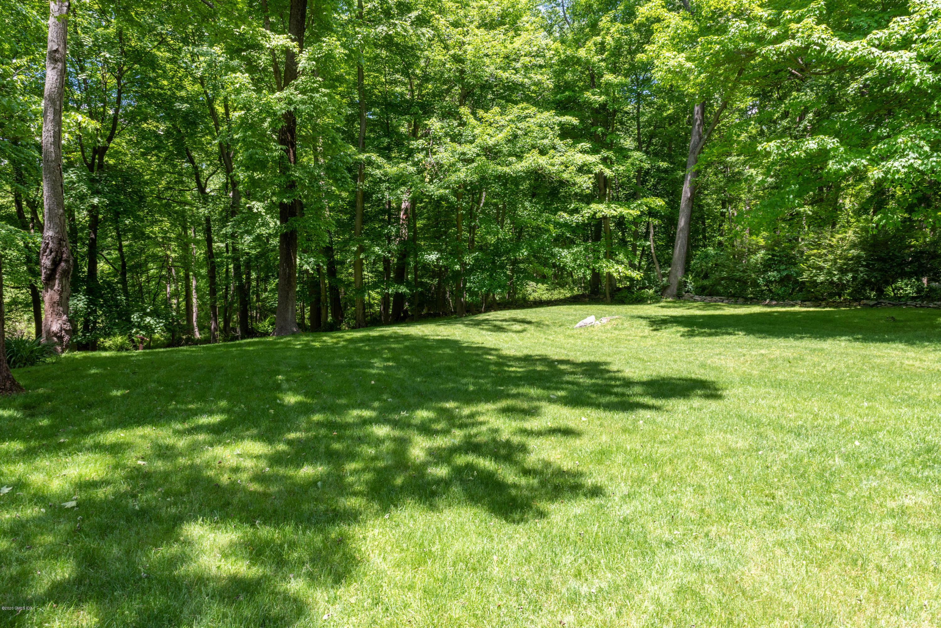 51-0 Burying Hill Road Greenwich, CT 06831 - Photo 37 of 47 a view of a grassy field with trees