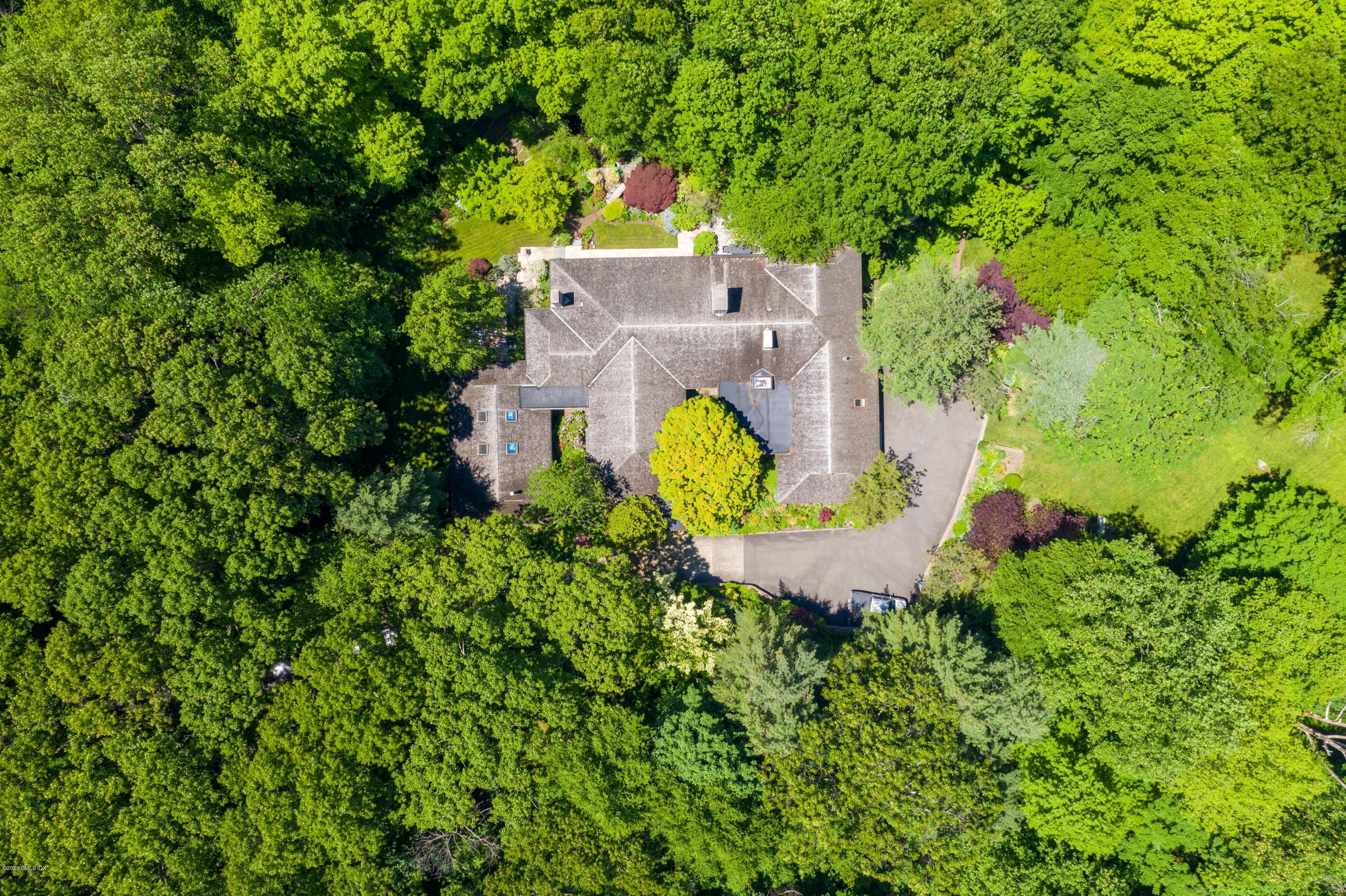 51-0 Burying Hill Road Greenwich, CT 06831 - Photo 40 of 47 an aerial view of a house with a yard and swimming pool