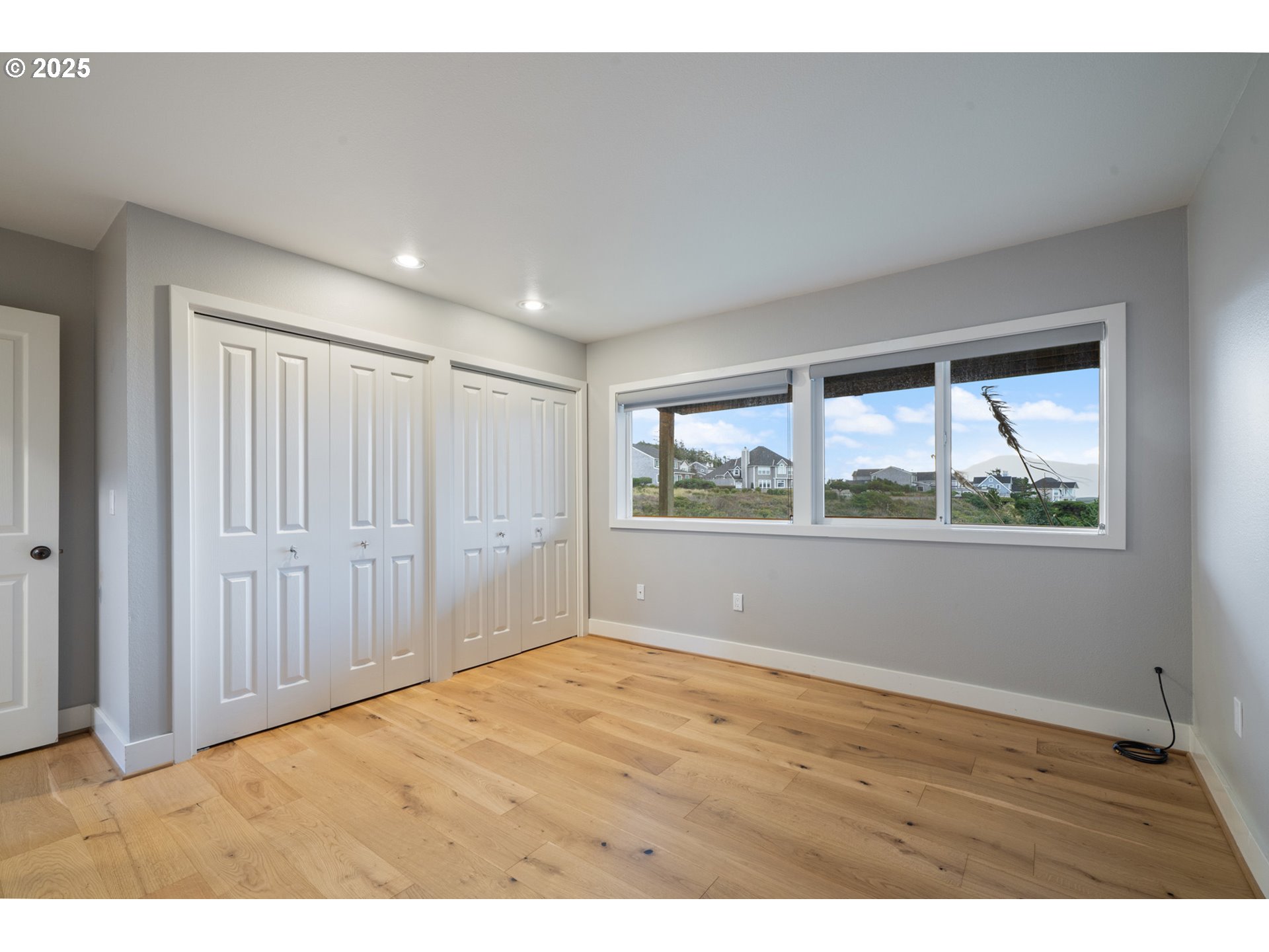 455 Capes Drive Oceanside, OR 97141 - Photo 24 of 48 a view of an empty room with a window