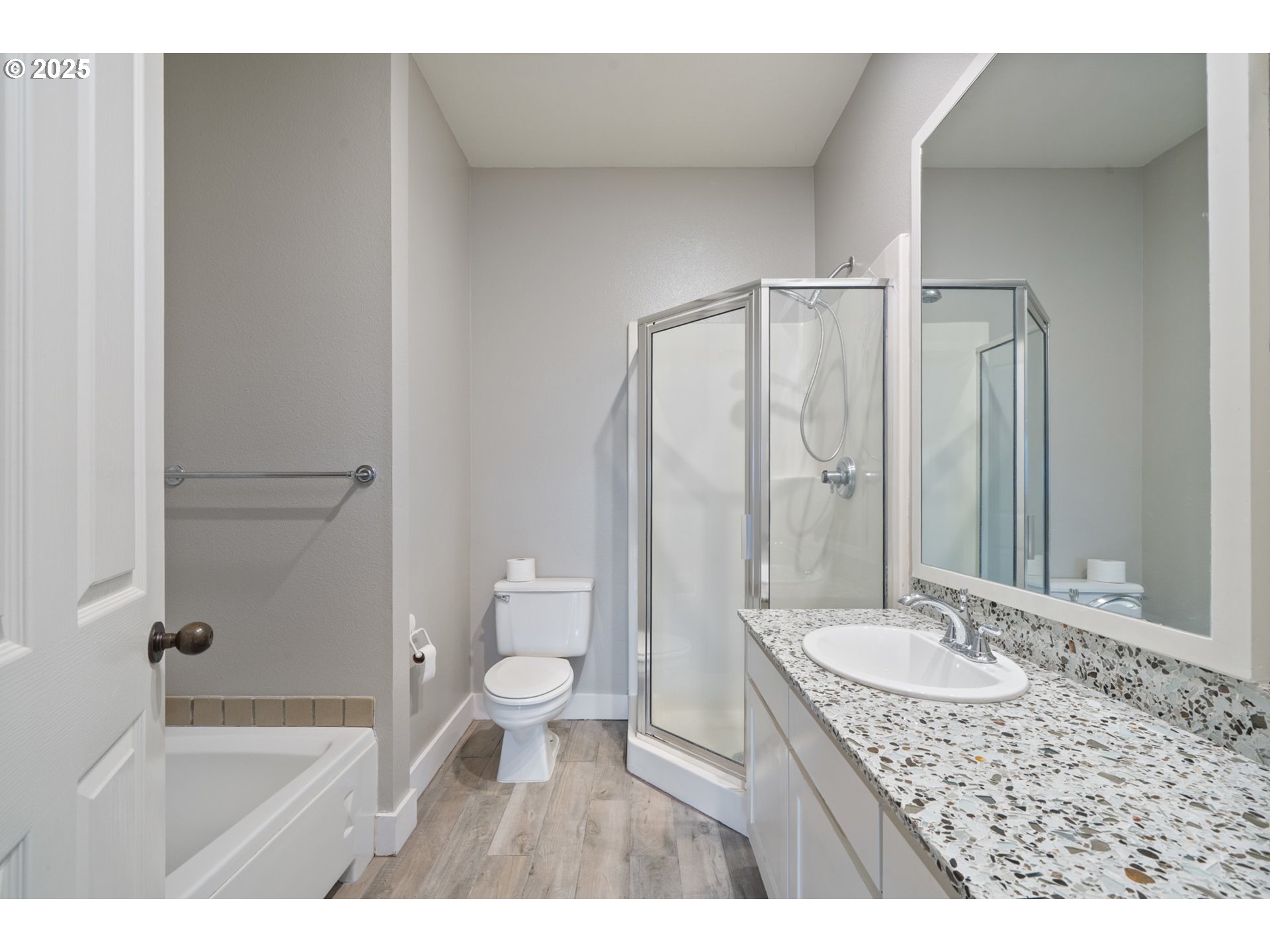 455 Capes Drive Oceanside, OR 97141 - Photo 28 of 48 a bathroom with a granite countertop sink a toilet a mirror and shower