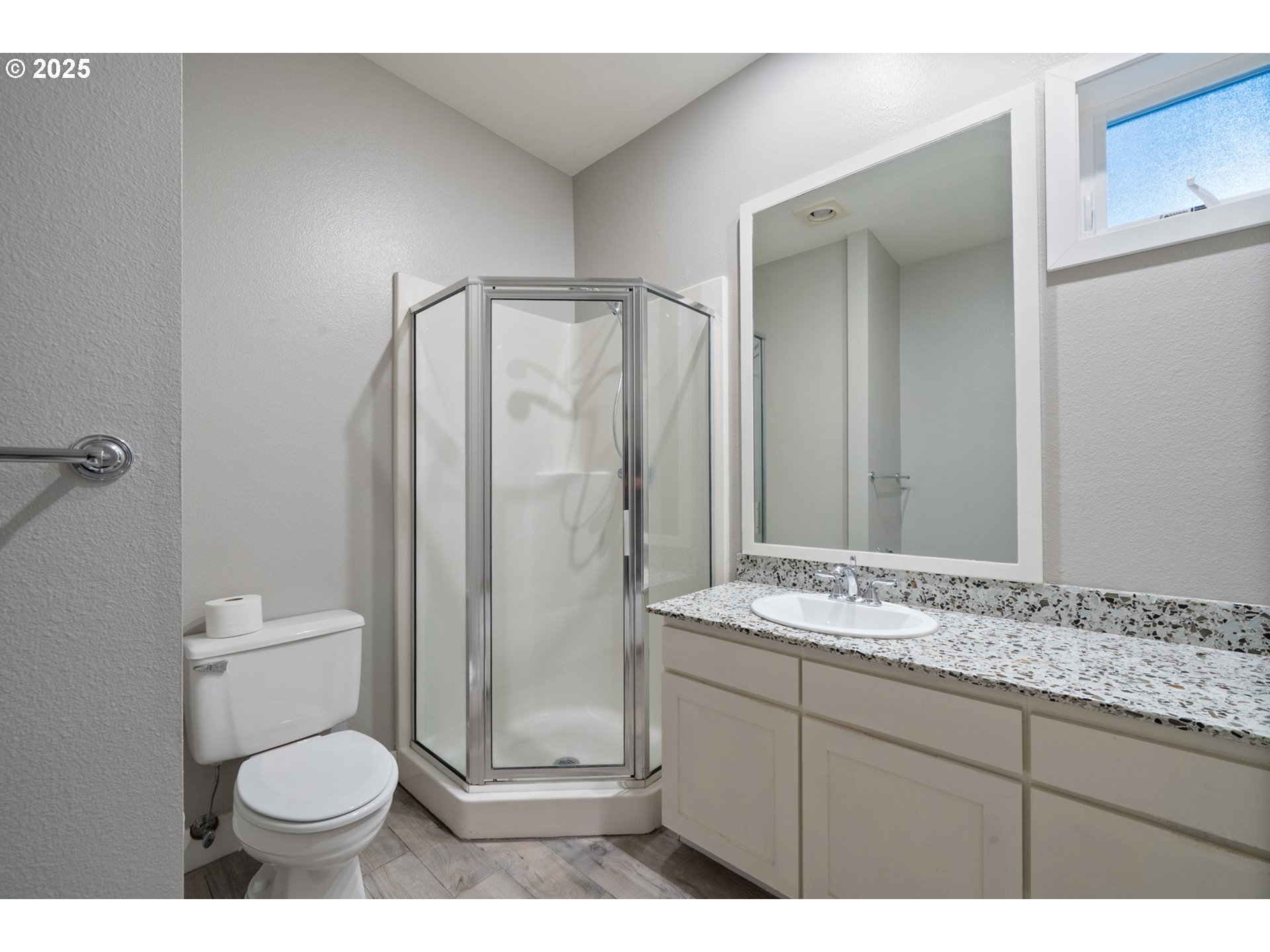 455 Capes Drive Oceanside, OR 97141 - Photo 29 of 48 a bathroom with a granite countertop toilet sink and mirror