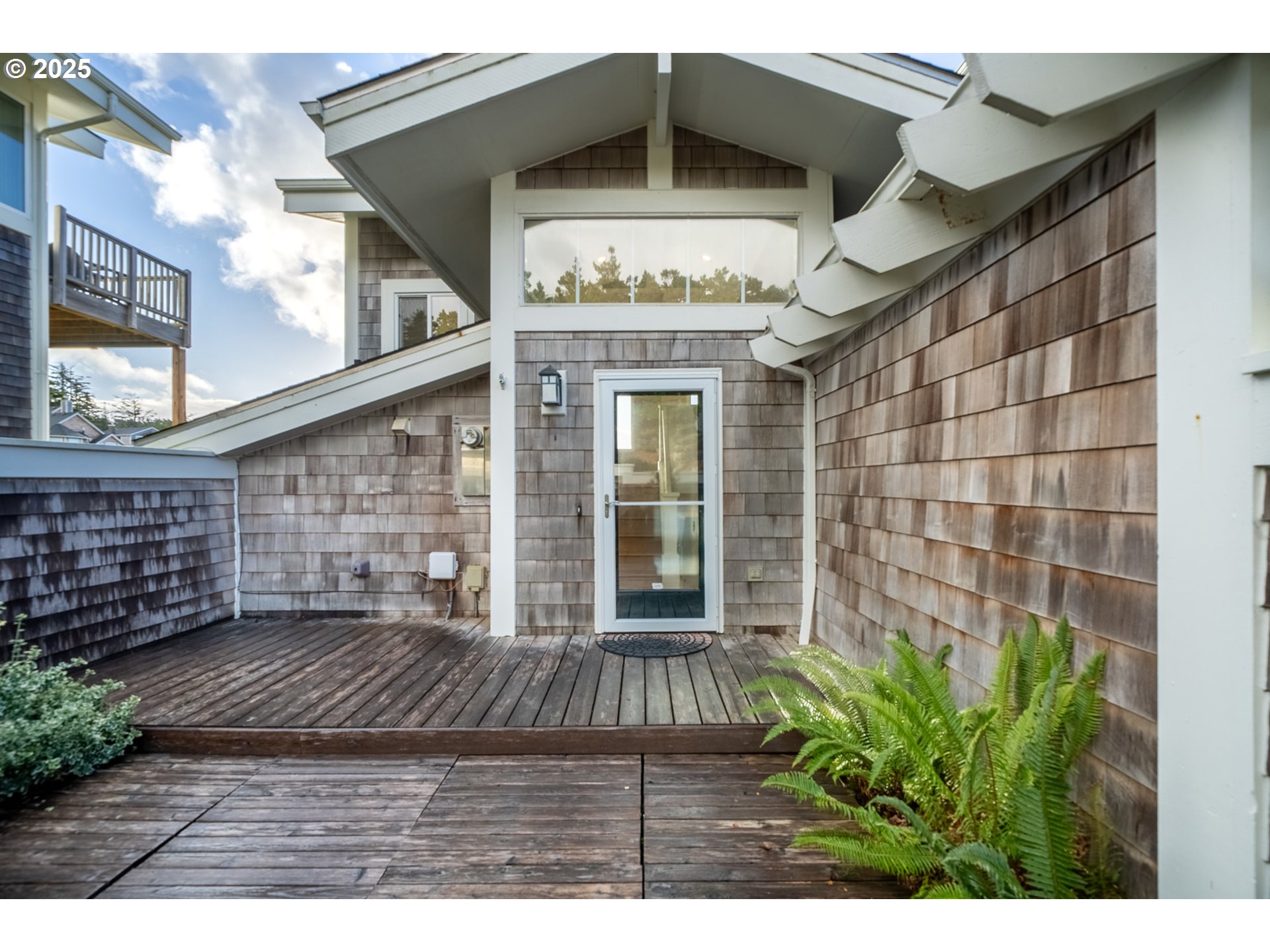 455 Capes Drive Oceanside, OR 97141 - Photo 39 of 48 a view of entryway with a front door