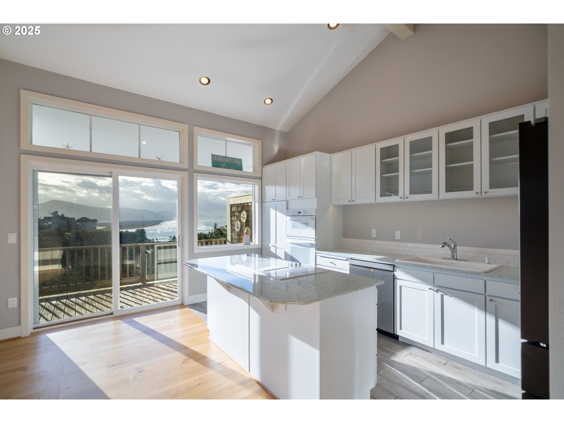 455 Capes Drive Oceanside, OR 97141 - Photo 5 of 48 a kitchen with a sink and cabinets