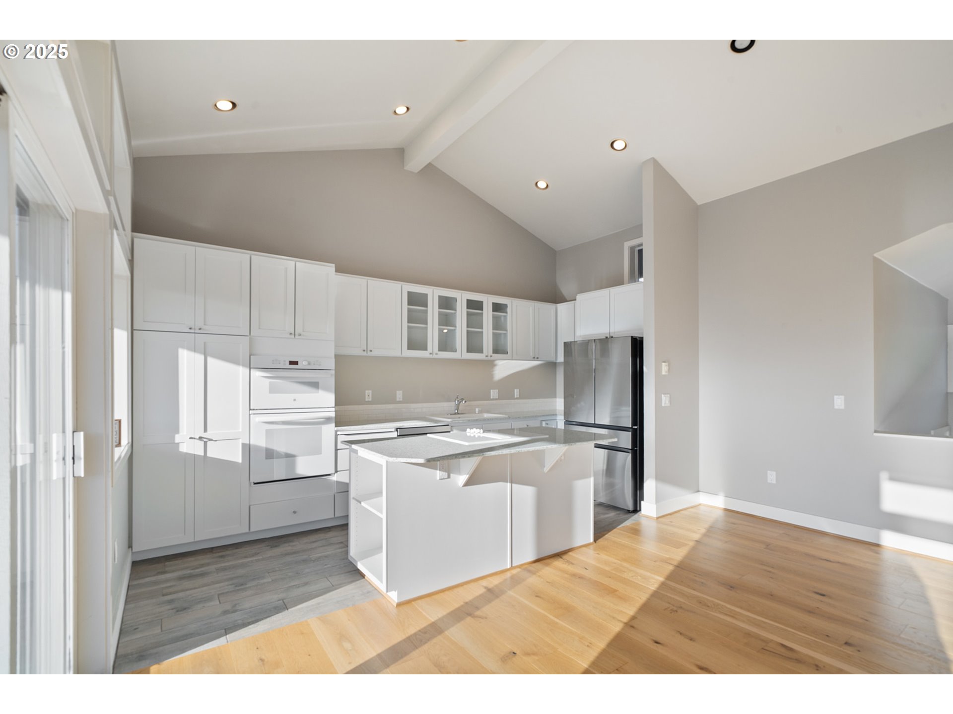 455 Capes Drive Oceanside, OR 97141 - Photo 6 of 48 a kitchen with a refrigerator and a sink