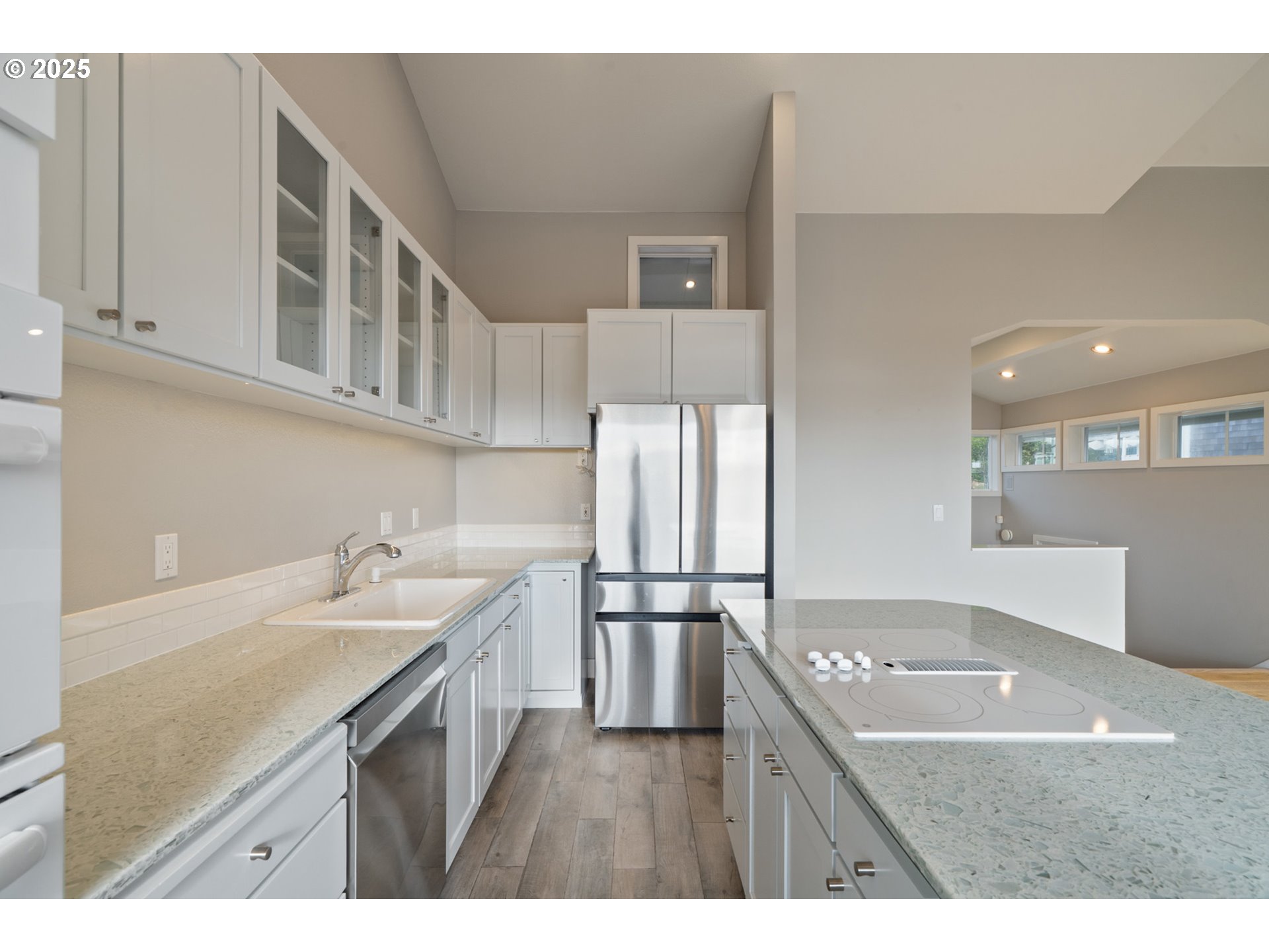 455 Capes Drive Oceanside, OR 97141 - Photo 9 of 48 a kitchen with kitchen island a sink stove and refrigerator