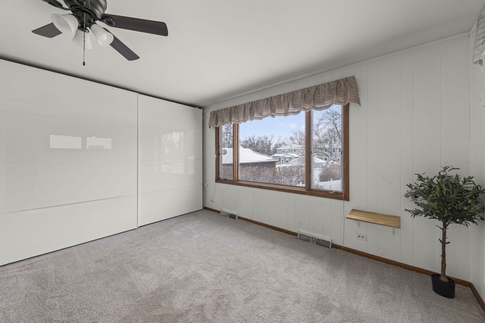 357 Bryant Avenue Glen Ellyn, IL 60137 - Photo 11 of 22 a view of an empty room with a window