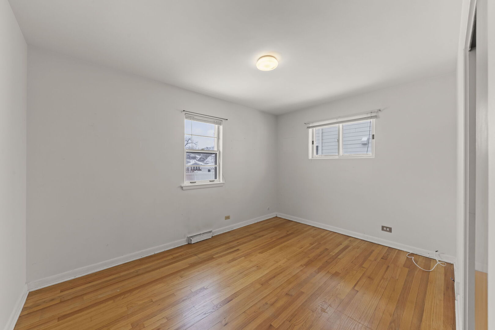 357 Bryant Avenue Glen Ellyn, IL 60137 - Photo 8 of 22 wooden floor in an empty room
