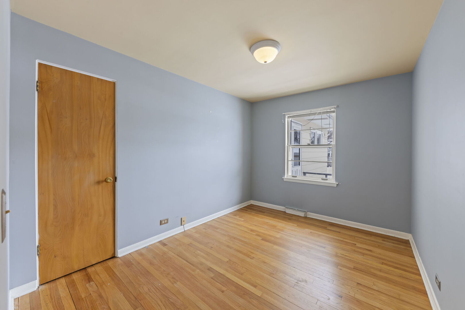 357 Bryant Avenue Glen Ellyn, IL 60137 - Photo 9 of 22 a view of empty room with wooden floor