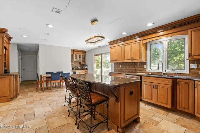 a very nice looking kitchen with a large window