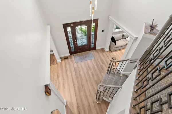 a view of entryway with wooden floor
