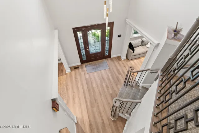 a view of entryway with wooden floor
