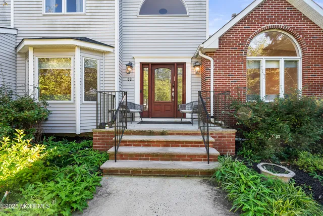 a front view of a house with a porch