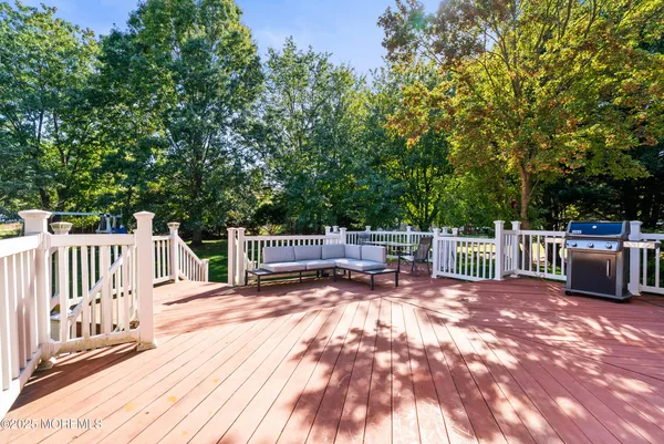 a view of a deck with a wooden fence