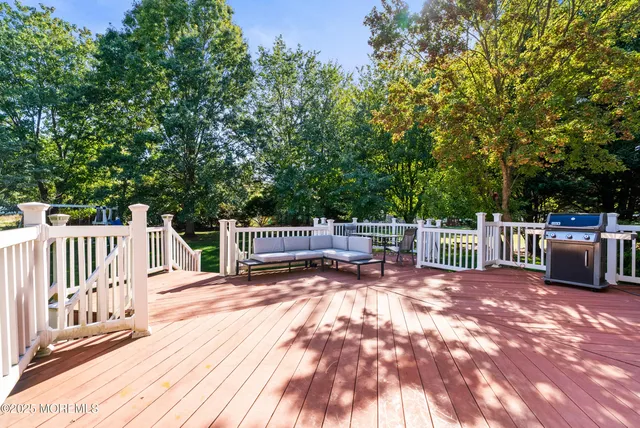 a view of a deck with a wooden fence