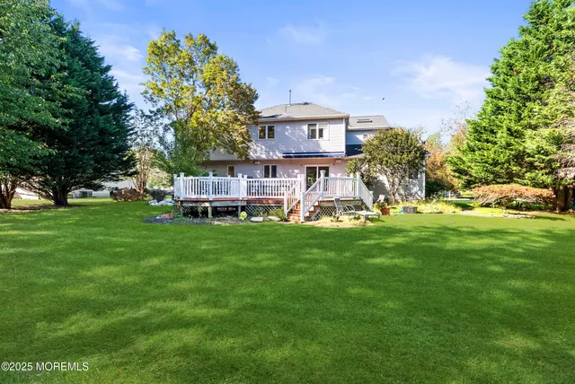 a view of a house with a yard porch and sitting area