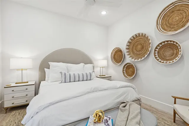 a bedroom with a bed and a large window