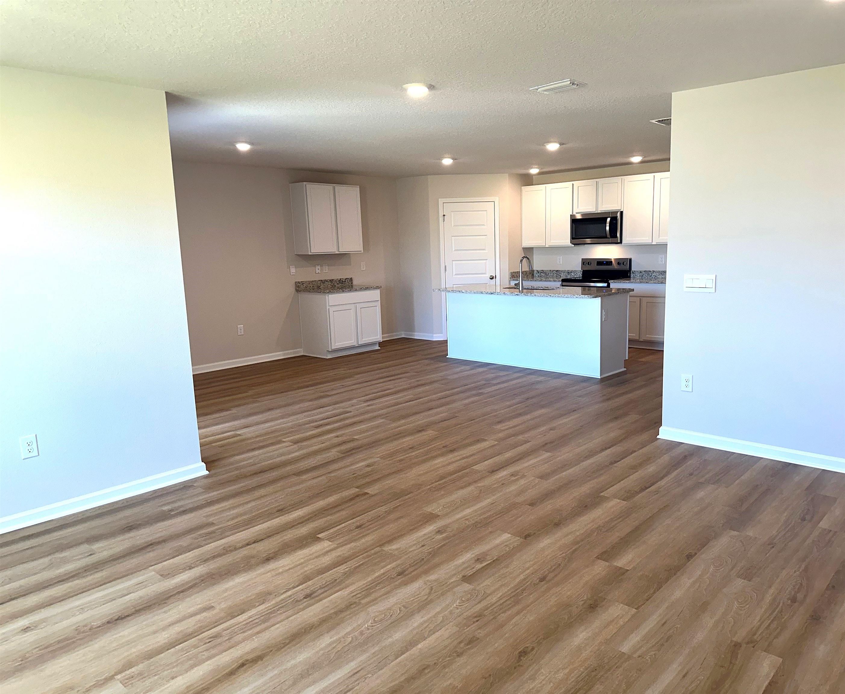 1234 Hayward Loop Foley, AL 36535 - Photo 9 of 31 Living room to kitchen