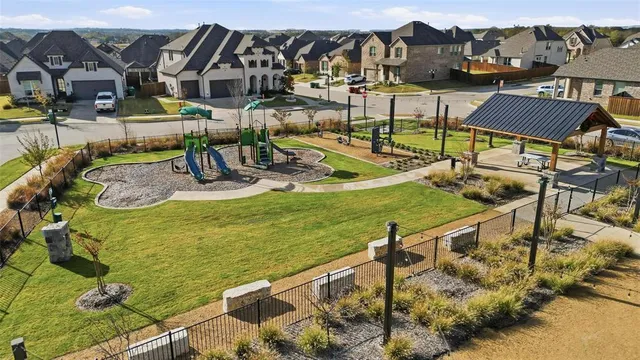 an aerial view of residential building and ocean view