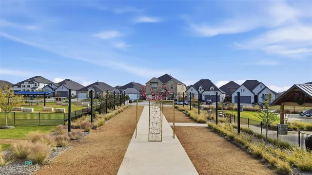 a view of a house with pool and chairs