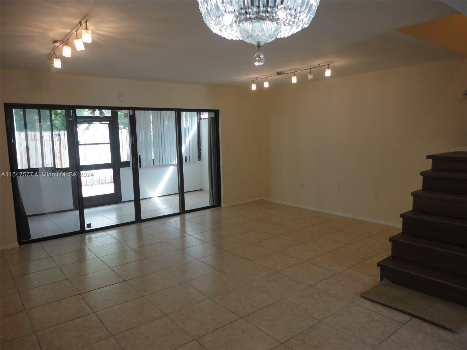 3321 Raleigh Street, Unit 3H Hollywood, FL 33021 - Photo 11 of 38 wooden floor in an empty room with a window