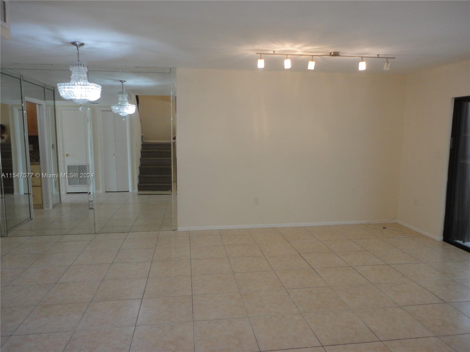 3321 Raleigh Street, Unit 3H Hollywood, FL 33021 - Photo 12 of 38 an empty room with fan and entrance