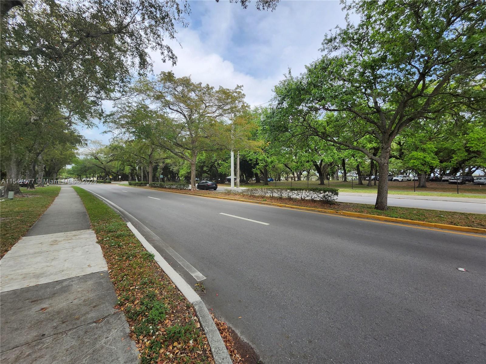 3321 Raleigh Street, Unit 3H Hollywood, FL 33021 - Photo 2 of 38 a street view with large trees