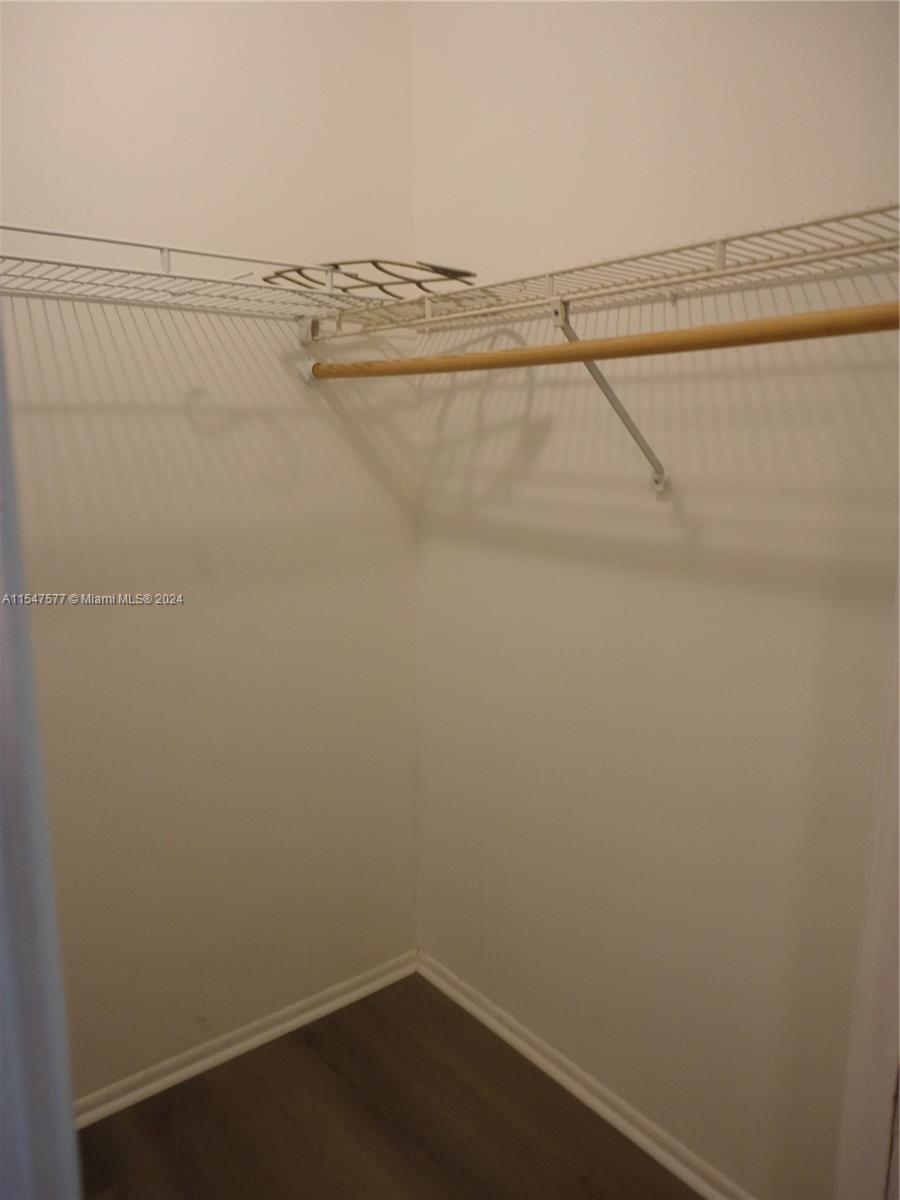 3321 Raleigh Street, Unit 3H Hollywood, FL 33021 - Photo 22 of 38 a view of a room with racks on the wall