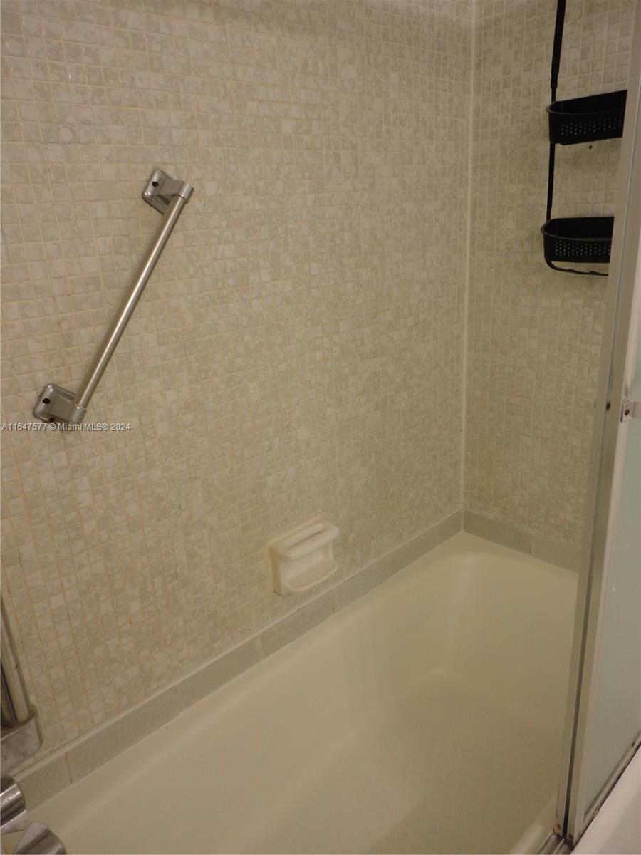 3321 Raleigh Street, Unit 3H Hollywood, FL 33021 - Photo 26 of 38 a bathroom with a shower