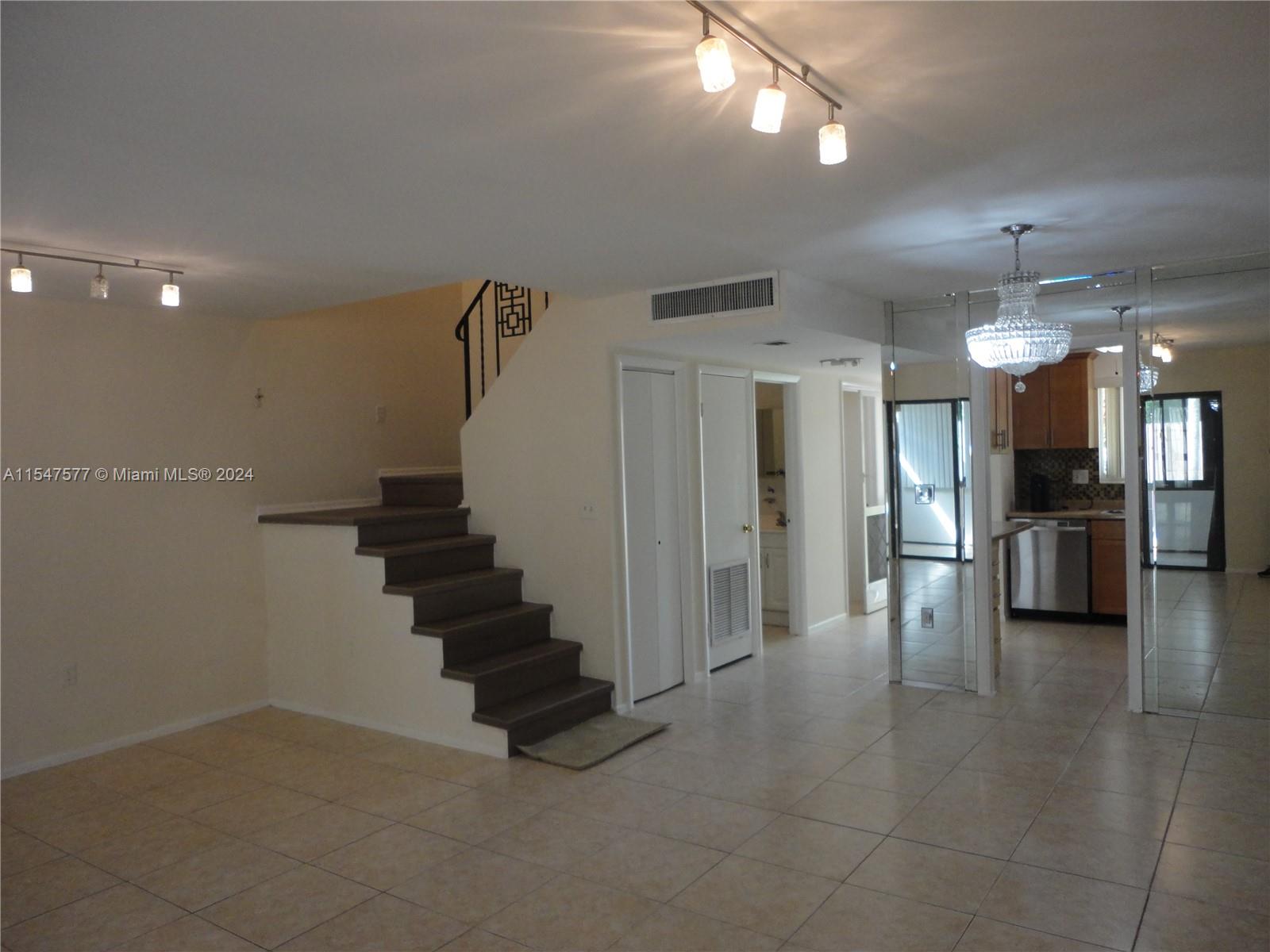 3321 Raleigh Street, Unit 3H Hollywood, FL 33021 - Photo 3 of 38 a view of a hallway with seating area
