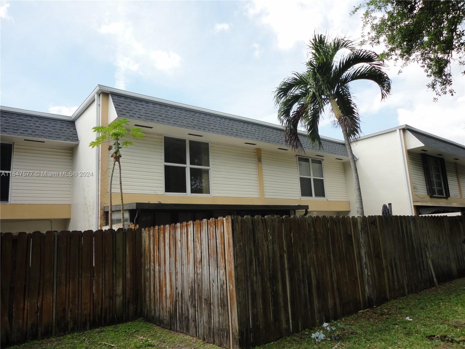 3321 Raleigh Street, Unit 3H Hollywood, FL 33021 - Photo 33 of 38 a front view of a house with a garden