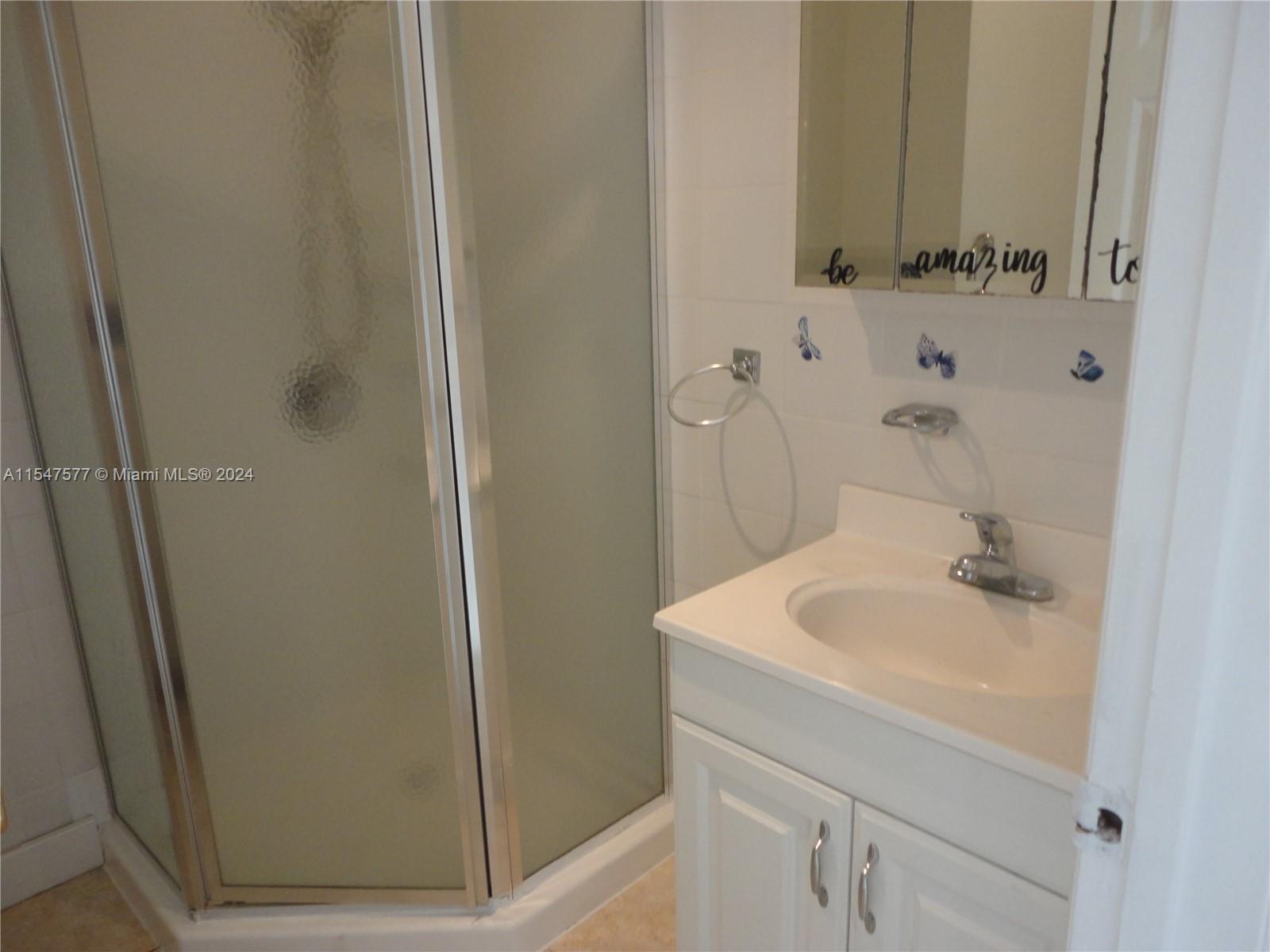 3321 Raleigh Street, Unit 3H Hollywood, FL 33021 - Photo 7 of 38 a bathroom with a sink and a mirror