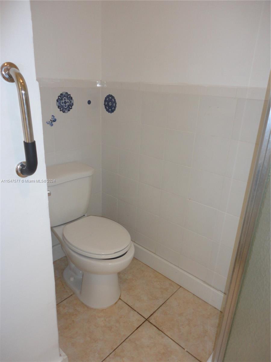 3321 Raleigh Street, Unit 3H Hollywood, FL 33021 - Photo 8 of 38 a bathroom with a toilet and a shower