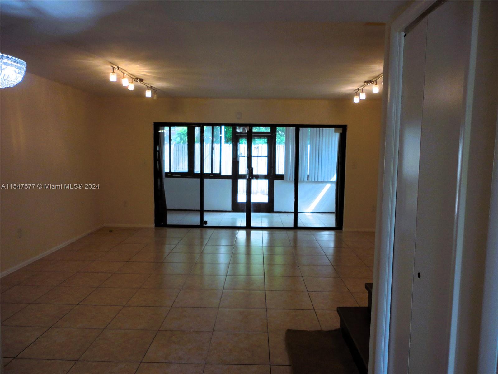 3321 Raleigh Street, Unit 3H Hollywood, FL 33021 - Photo 9 of 38 a view of an empty room with a window