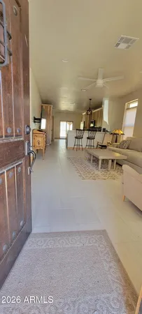 a kitchen with kitchen island granite countertop a sink and a stove top oven