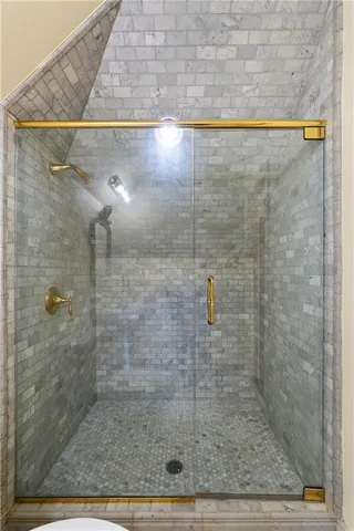 a view of a swimming pool with a bench and trees