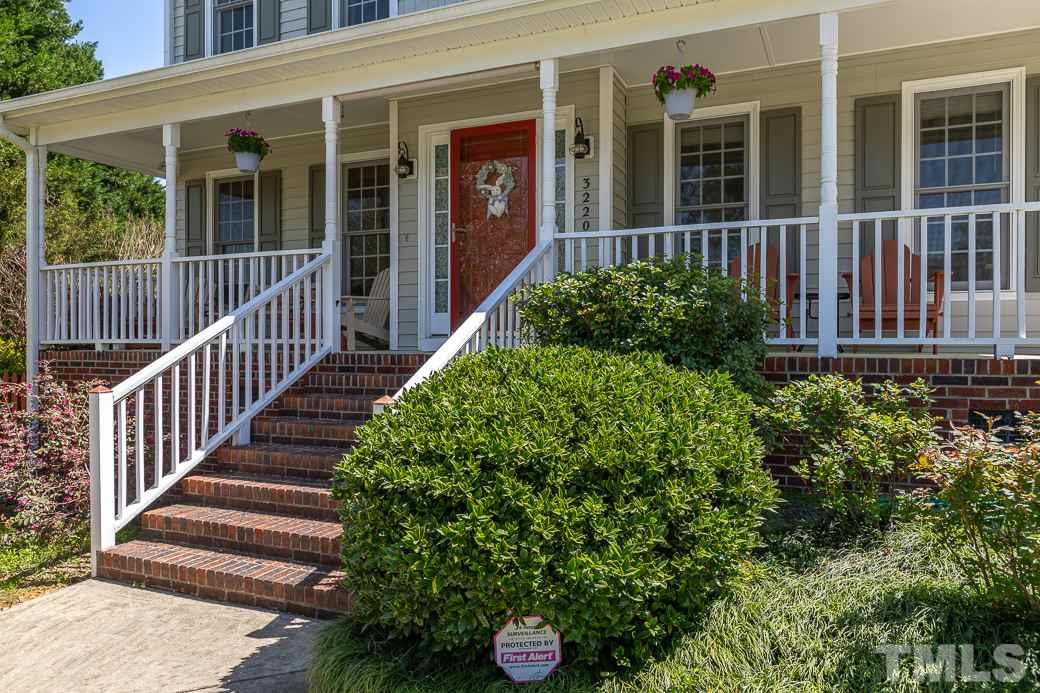 3220 Sandy Bluff Road Raleigh, NC 27616 - Photo 3 of 23 a view of a house with a flower garden and wooden floor