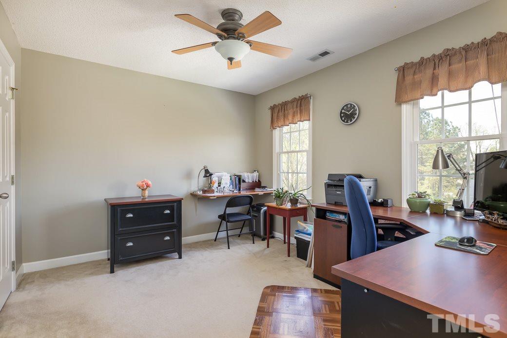 3220 Sandy Bluff Road Raleigh, NC 27616 - Photo 22 of 23 a view of a workspace with furniture and a window