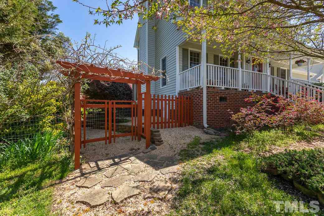 3220 Sandy Bluff Road Raleigh, NC 27616 - Photo 4 of 23 a view of a backyard with a tree