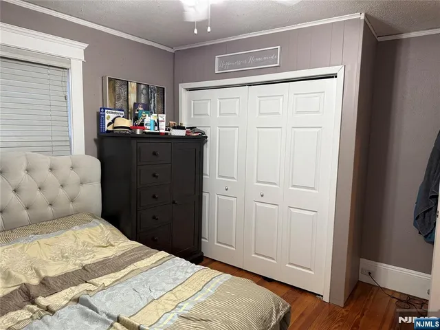 a bedroom with a bed and a mirror