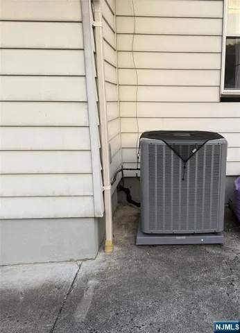 a view of a livingroom with wooden floor and a flat screen tv