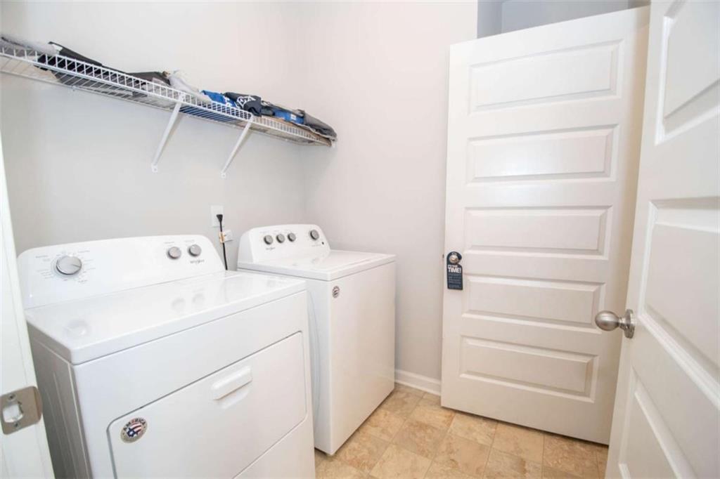 531 Carleton Place Locust Grove, GA 30248 - Photo 23 of 41 a utility room with dryer and washer