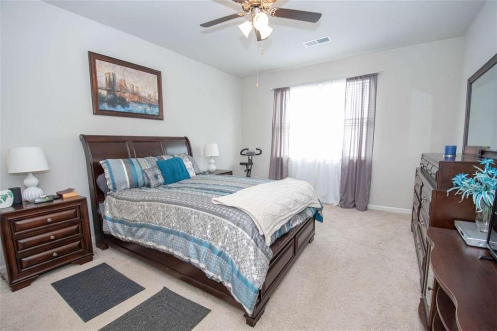 531 Carleton Place Locust Grove, GA 30248 - Photo 25 of 41 a bedroom with bed and window