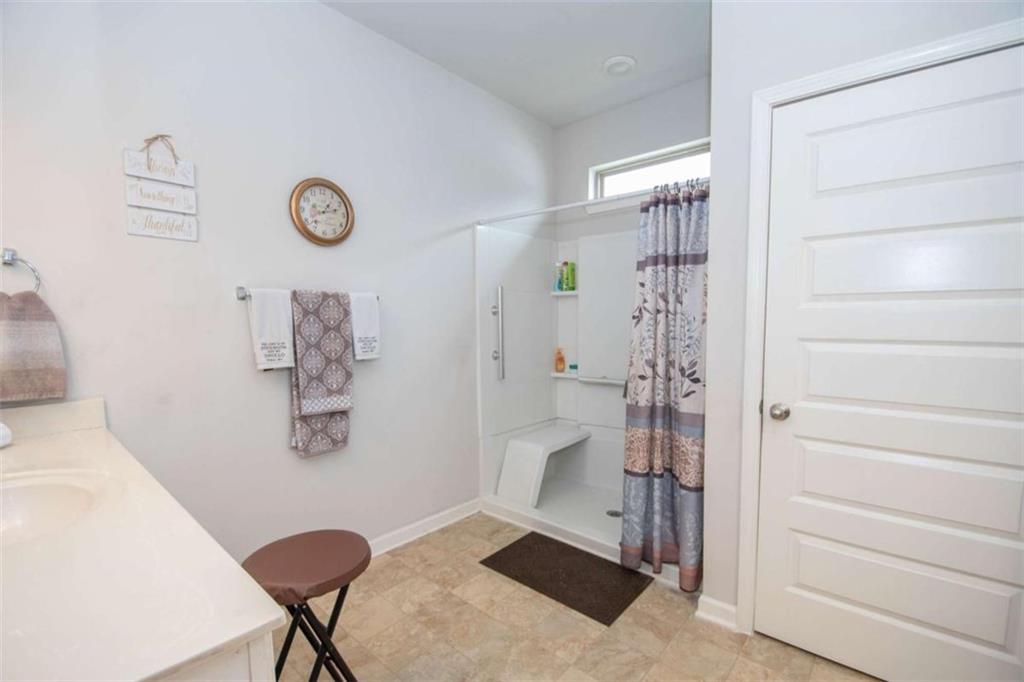 531 Carleton Place Locust Grove, GA 30248 - Photo 28 of 41 a bathroom with a shower and a sink