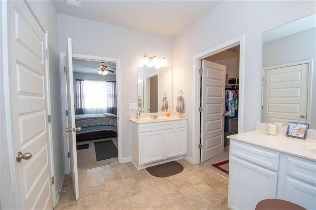 531 Carleton Place Locust Grove, GA 30248 - Photo 29 of 41 a bathroom with a sink and a mirror