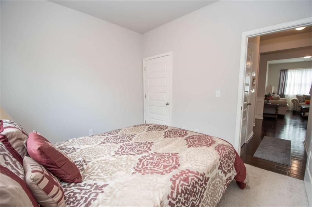 531 Carleton Place Locust Grove, GA 30248 - Photo 32 of 41 a bedroom with a bed and a view of bedroom
